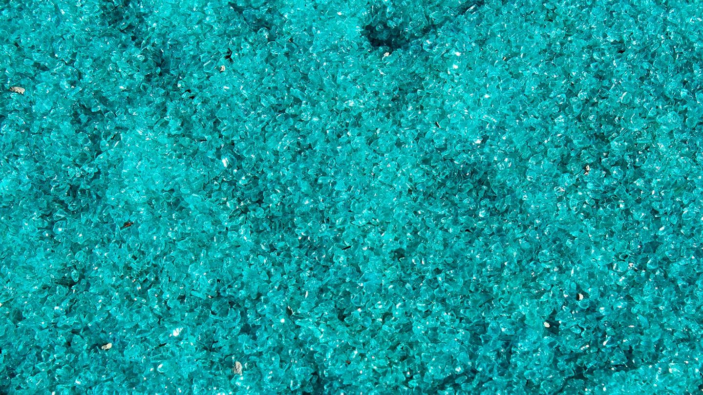 Blue glass particles