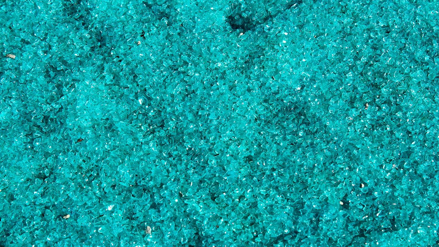 Blue glass particles