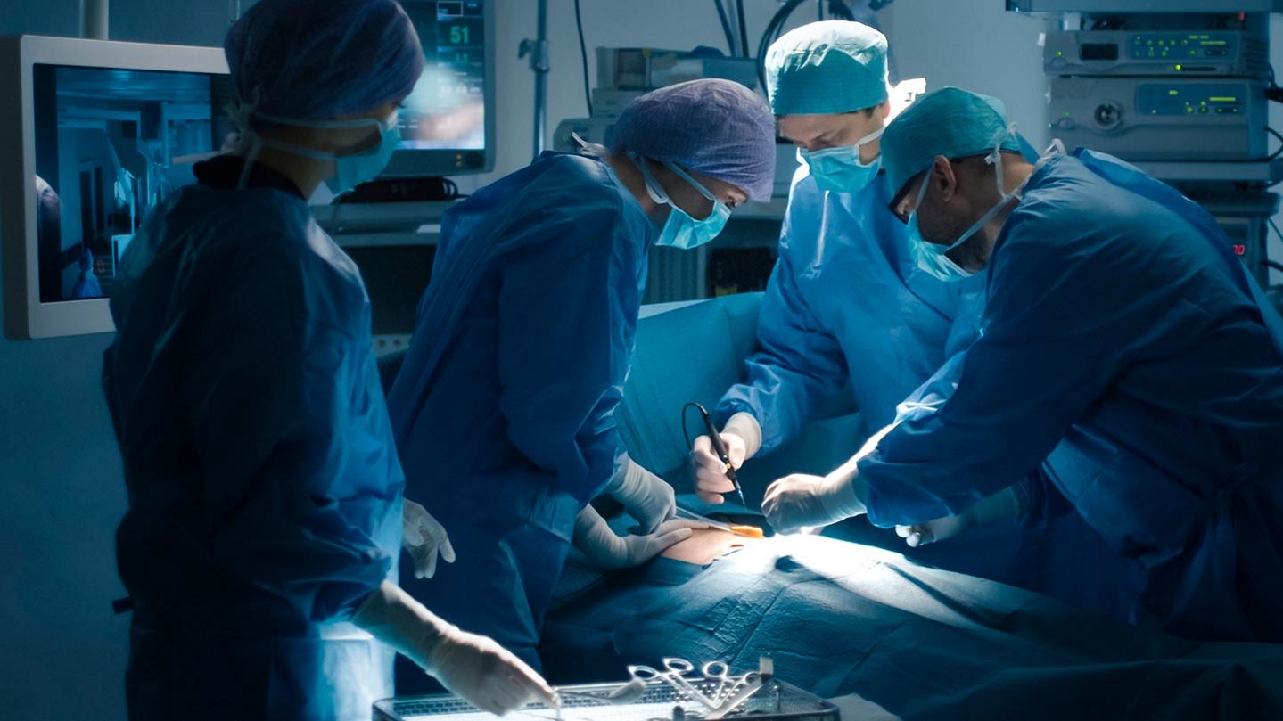 Medical Team Performing Surgical Operation in Modern Operating Room