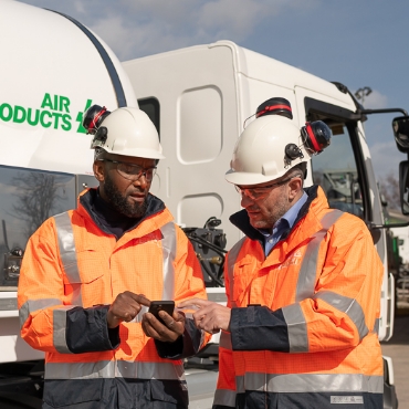 Two male Air Products truck drivers