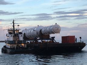 LNG heat exchanger, with tugboat, leaving Port Manatee