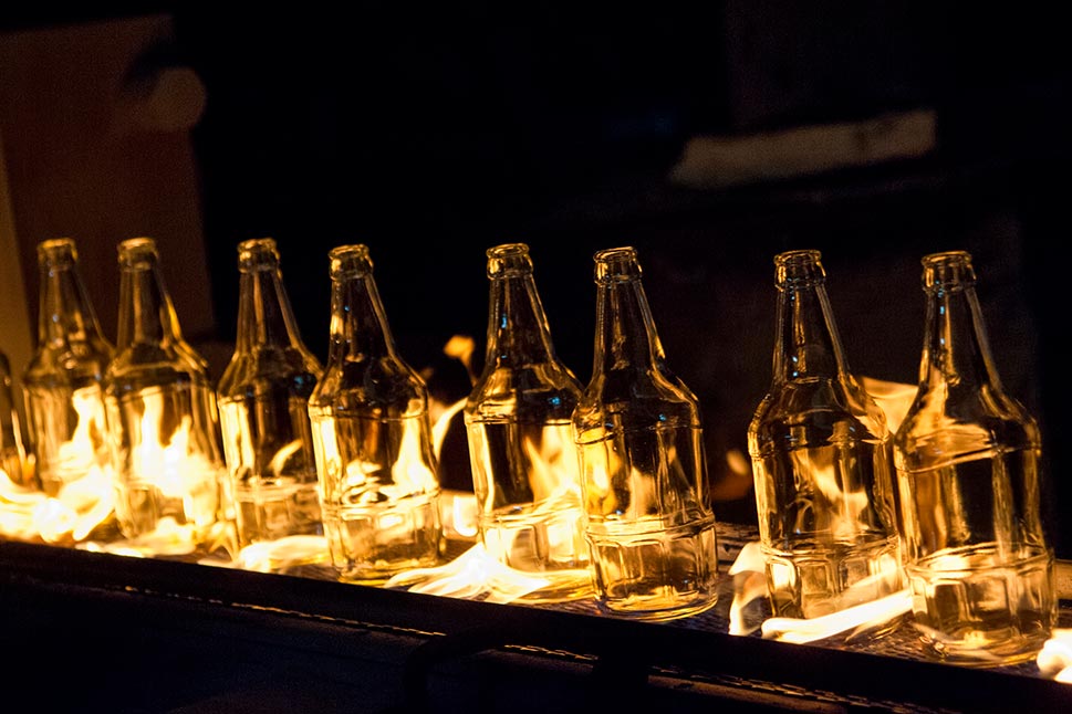 Glass bottles during forming operation