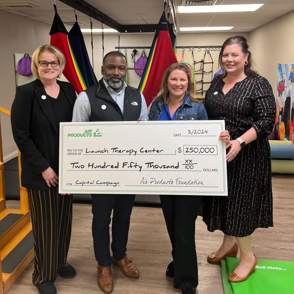 Air Products employees join Chantelle B. Varnado, Executive Director of Launch Therapy Center to present a $250,000 for the center’s capital campaign